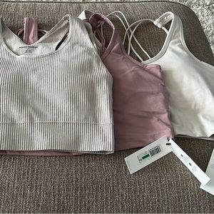 3 crop tanks with built in bra. All 3 new with tags